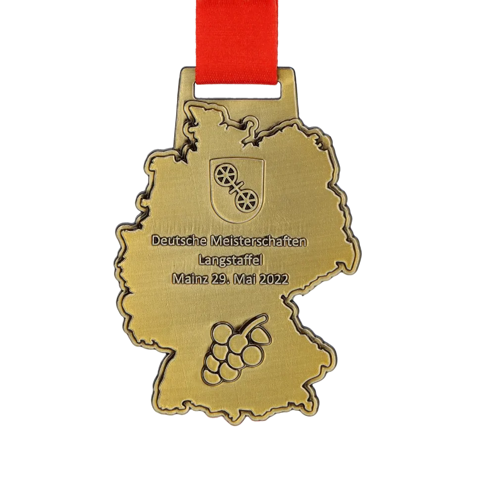 A golden medal shaped like Germany on a red ribbon.