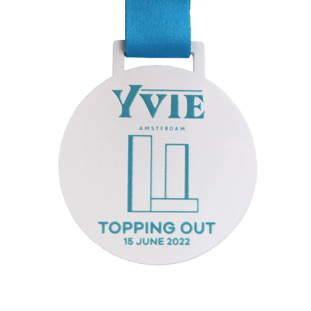 White Round Medal with Blue Lettering