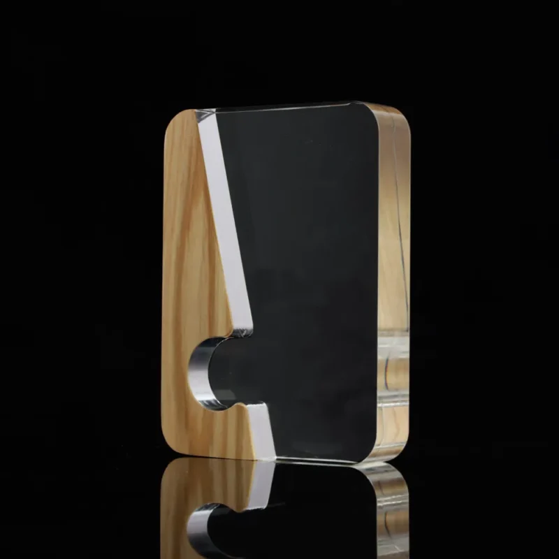 Modern mixed-material award combining wood and black acrylic with a cutout.